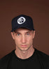 Blue Olokun Varsity Mesh Cap with a slightly Curved Peak.